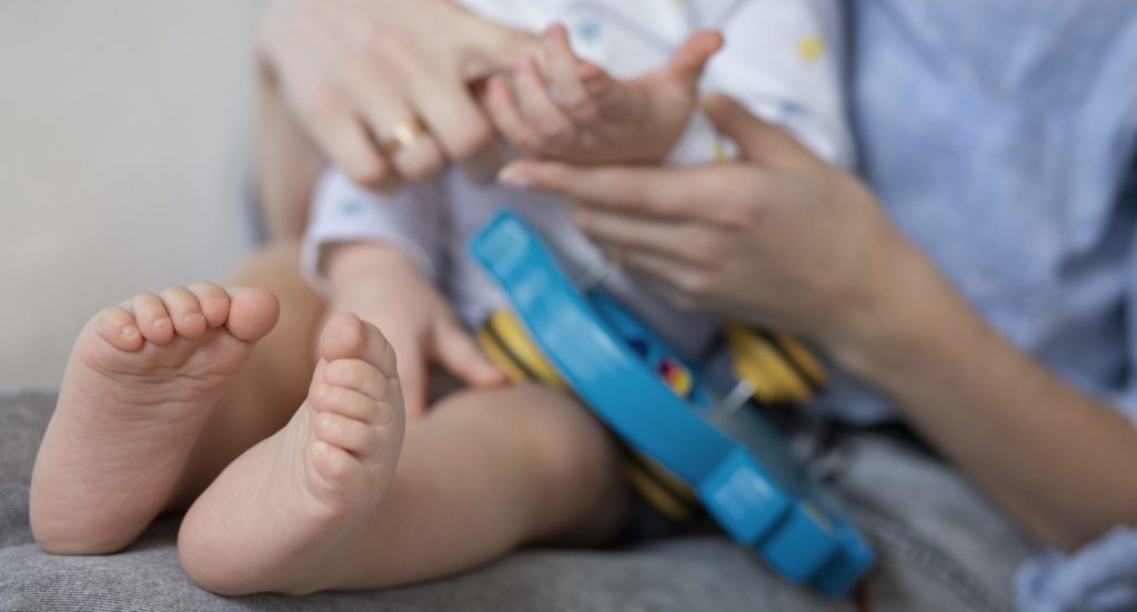 close-up-parent-holding-cute-baby